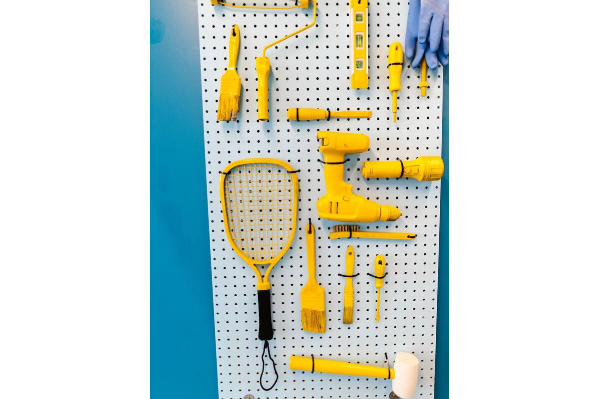 Bright organized garage pegboard with tools neatly hung